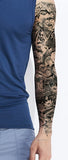 Tattoo temporaire couvrant le bras et représentant un tigre au milieu des fleurs et papillons