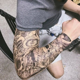 Tatouage full arm crânes et roses